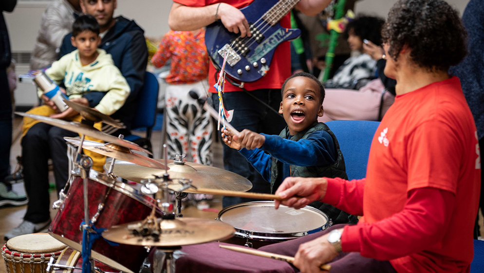 a child plays with musical instruments